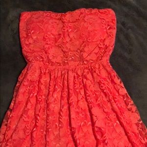 Strapless lace coral peep hole dress